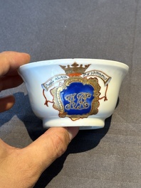 A pair of Chinese armorial famille rose cups and saucers with the arms of Tyndall for the English market and two monogrammed bowls, Qianlong