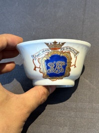 A pair of Chinese armorial famille rose cups and saucers with the arms of Tyndall for the English market and two monogrammed bowls, Qianlong