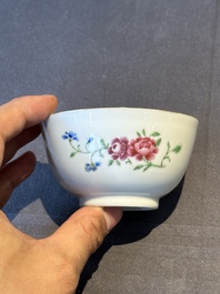 A pair of Chinese armorial famille rose cups and saucers with the arms of Tyndall for the English market and two monogrammed bowls, Qianlong