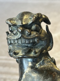 A large Chinese bronze censer and cover with a Buddhist lion, Ming