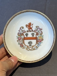 A pair of Chinese armorial famille rose cups and saucers with the arms of Tyndall for the English market and two monogrammed bowls, Qianlong