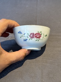 A pair of Chinese armorial famille rose cups and saucers with the arms of Tyndall for the English market and two monogrammed bowls, Qianlong