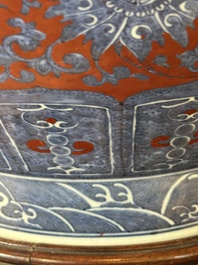A Chinese blue and white, and iron-red 'bajixiang' 'hu' vase on wooden stand, Qianlong mark, 19th C.
