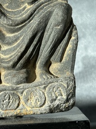 A Gandhara grey schist sculpture of the Bodhisattva Maitreya, a sculpture of a master with a child and a fragment of a divinity, 1/5th C.