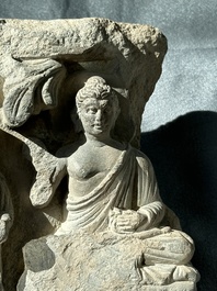 A Gandhara grey schist fragment of a seated Buddha with his disciple and a fragment with five figures, 1st/3rd C.