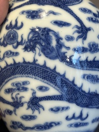 A Chinese blue and white 'dragon' vase, a famille rose 'millefleurs' vase and a teapot, Qianlong mark, 19/20th C.