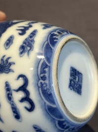 A Chinese blue and white 'dragon' vase, a famille rose 'millefleurs' vase and a teapot, Qianlong mark, 19/20th C.