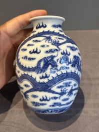 A Chinese blue and white 'dragon' vase, a famille rose 'millefleurs' vase and a teapot, Qianlong mark, 19/20th C.