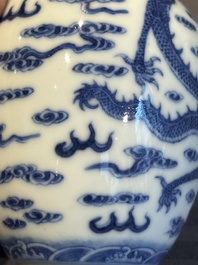 A Chinese blue and white 'dragon' vase, a famille rose 'millefleurs' vase and a teapot, Qianlong mark, 19/20th C.