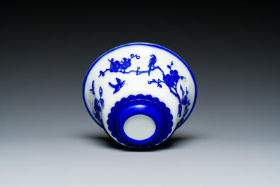 A Chinese blue-overlay white Beijing glass vase, a multi-colour brush pot and three bowls, 19th C.