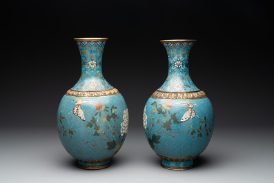 A pair of Chinese cloisonn&eacute; 'flowers and insects' vases on wooden stands, 18/19th C.