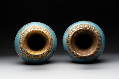 A pair of Chinese cloisonn&eacute; 'flowers and insects' vases on wooden stands, 18/19th C.