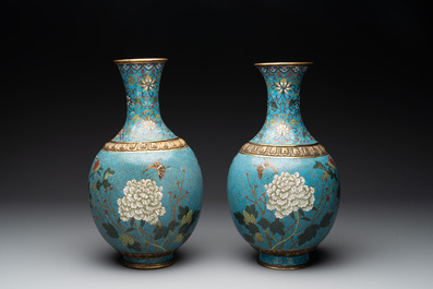 A pair of Chinese cloisonn&eacute; 'flowers and insects' vases on wooden stands, 18/19th C.