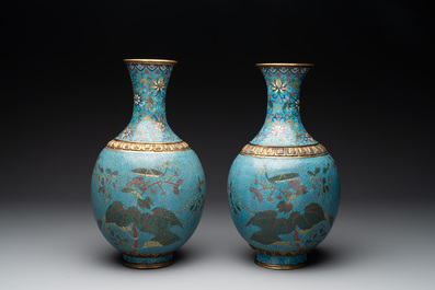 A pair of Chinese cloisonn&eacute; 'flowers and insects' vases on wooden stands, 18/19th C.