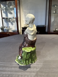 A fine Chinese sancai-glazed figure of a Luohan, Qianlong