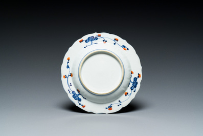 A Chinese verte biscuit teapot, a English-decorated blue and white plate and a ewer, Kangxi