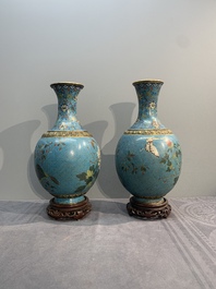 A pair of Chinese cloisonn&eacute; 'flowers and insects' vases on wooden stands, 18/19th C.