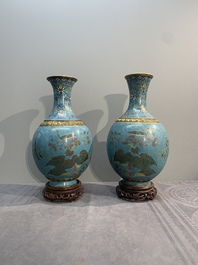 A pair of Chinese cloisonn&eacute; 'flowers and insects' vases on wooden stands, 18/19th C.