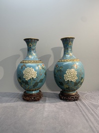 A pair of Chinese cloisonn&eacute; 'flowers and insects' vases on wooden stands, 18/19th C.