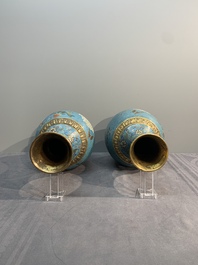 A pair of Chinese cloisonn&eacute; 'flowers and insects' vases on wooden stands, 18/19th C.