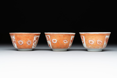 Six Chinese gilt-decorated iron-red cups and saucers with figural design, Yongzheng