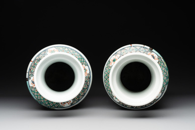 A pair of Chinese famille verte rouleau vases with narrative design, 19th C.