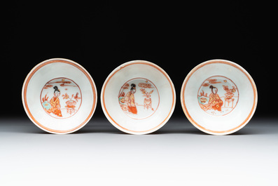 Six Chinese gilt-decorated iron-red cups and saucers with figural design, Yongzheng