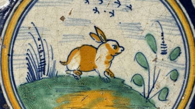 A polychrome Dutch Delft maiolica 'medallion' 'hare' tile, late 16th C.