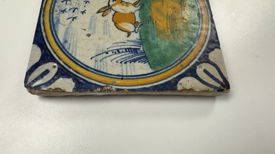 A polychrome Dutch Delft maiolica 'medallion' 'hare' tile, late 16th C.