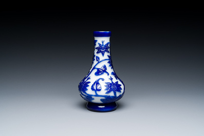 A Chinese blue-overlay white Beijing glass vase, a multi-colour brush pot and three bowls, 19th C.