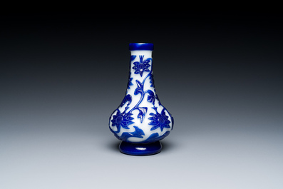 A Chinese blue-overlay white Beijing glass vase, a multi-colour brush pot and three bowls, 19th C.