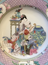 An extremely fine pair of Chinese famille rose 'ruby back' eggshell plates with a lady and playing boys, Yongzheng