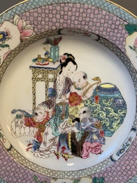 An extremely fine pair of Chinese famille rose 'ruby back' eggshell plates with a lady and playing boys, Yongzheng