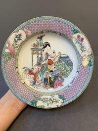 An extremely fine pair of Chinese famille rose 'ruby back' eggshell plates with a lady and playing boys, Yongzheng