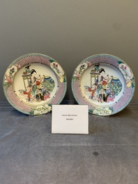 An extremely fine pair of Chinese famille rose 'ruby back' eggshell plates with a lady and playing boys, Yongzheng