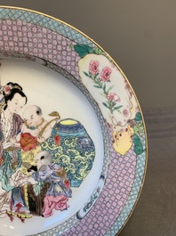 An extremely fine pair of Chinese famille rose 'ruby back' eggshell plates with a lady and playing boys, Yongzheng