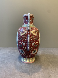 A fine Chinese famille rose ruby-sgraffito-ground 'Hai Wu Tian Shou 海屋添壽' vase with 'chilong' handles, Qianlong mark and of the period