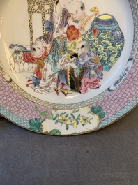 An extremely fine pair of Chinese famille rose 'ruby back' eggshell plates with a lady and playing boys, Yongzheng