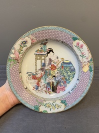 An extremely fine pair of Chinese famille rose 'ruby back' eggshell plates with a lady and playing boys, Yongzheng