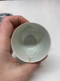 A Chinese gilt-decorated blue and white 'lotus scroll' square bowl, a saucer and a doucai 'dragon' cup, Daoguang mark and of the period