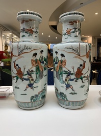 A pair of Chinese famille verte rouleau vases with narrative design, 19th C.