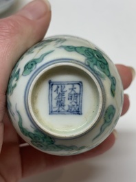 A Chinese gilt-decorated blue and white 'lotus scroll' square bowl, a saucer and a doucai 'dragon' cup, Daoguang mark and of the period