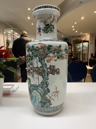 A pair of Chinese famille verte rouleau vases with narrative design, 19th C.