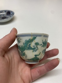 A Chinese gilt-decorated blue and white 'lotus scroll' square bowl, a saucer and a doucai 'dragon' cup, Daoguang mark and of the period