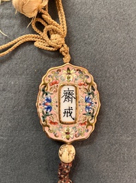 A Chinese famille rose pink-ground lobed 'abstinence' plaque, Qianlong/Jiaqing