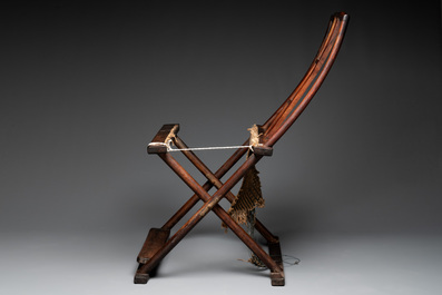 A Chinese huanghuali wooden folding chair, 17/18th C.