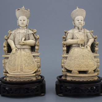A pair of Chinese carved ivory figures of the emperor couple, signed, 19th C.