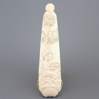 A carved ivory tobacco rasp depicting Satyr with a nymph, Dieppe, early 18th C.