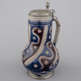 A Westerwald pewter-mounted jug in manganese and blue, 17th C.