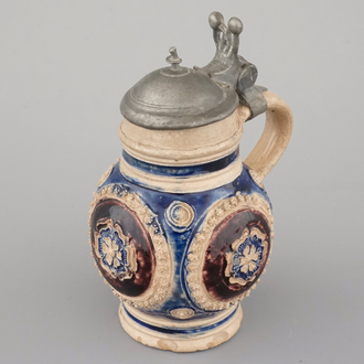 A manganese and blue Westerwald pewter-mounted globular jug, 17th C.